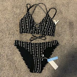 Black and white adorable bikini. Laces up in the back. ❤️